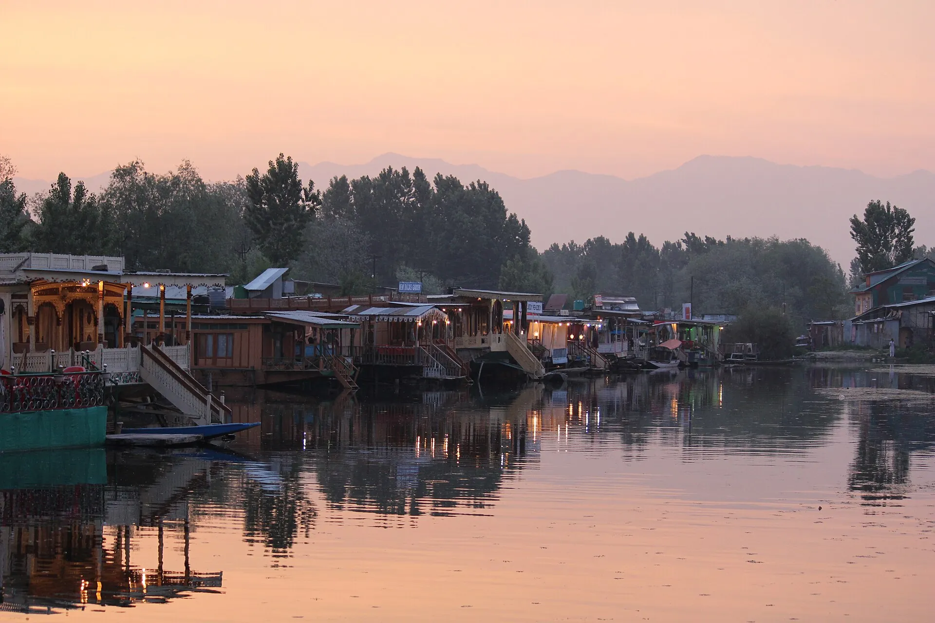 Houseboats glowing at dusk on Dal Lake, Srinagar